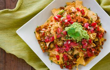 Loaded Vegan Nachos are the way to make your favorite Mexican dish healthy.