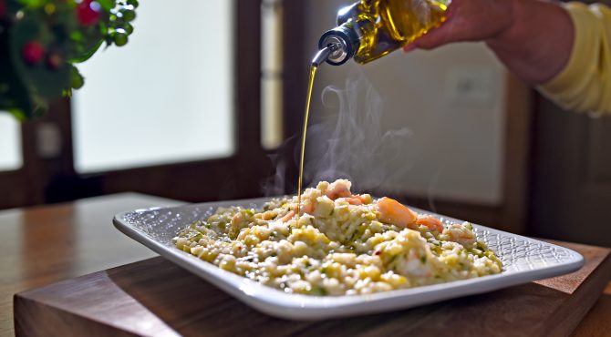 Adding the finishing touch to the Shrimp and Leek Risotto