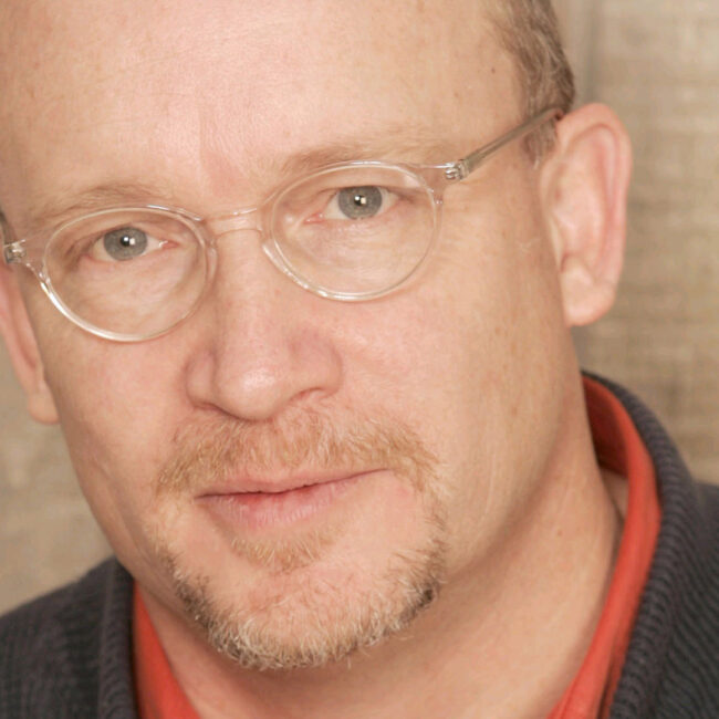 Headshot of director Alex Gibney.