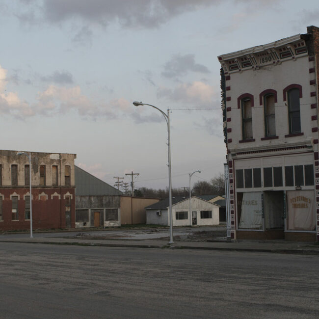 Decaying buildings face an empty street in small town Rich Hill