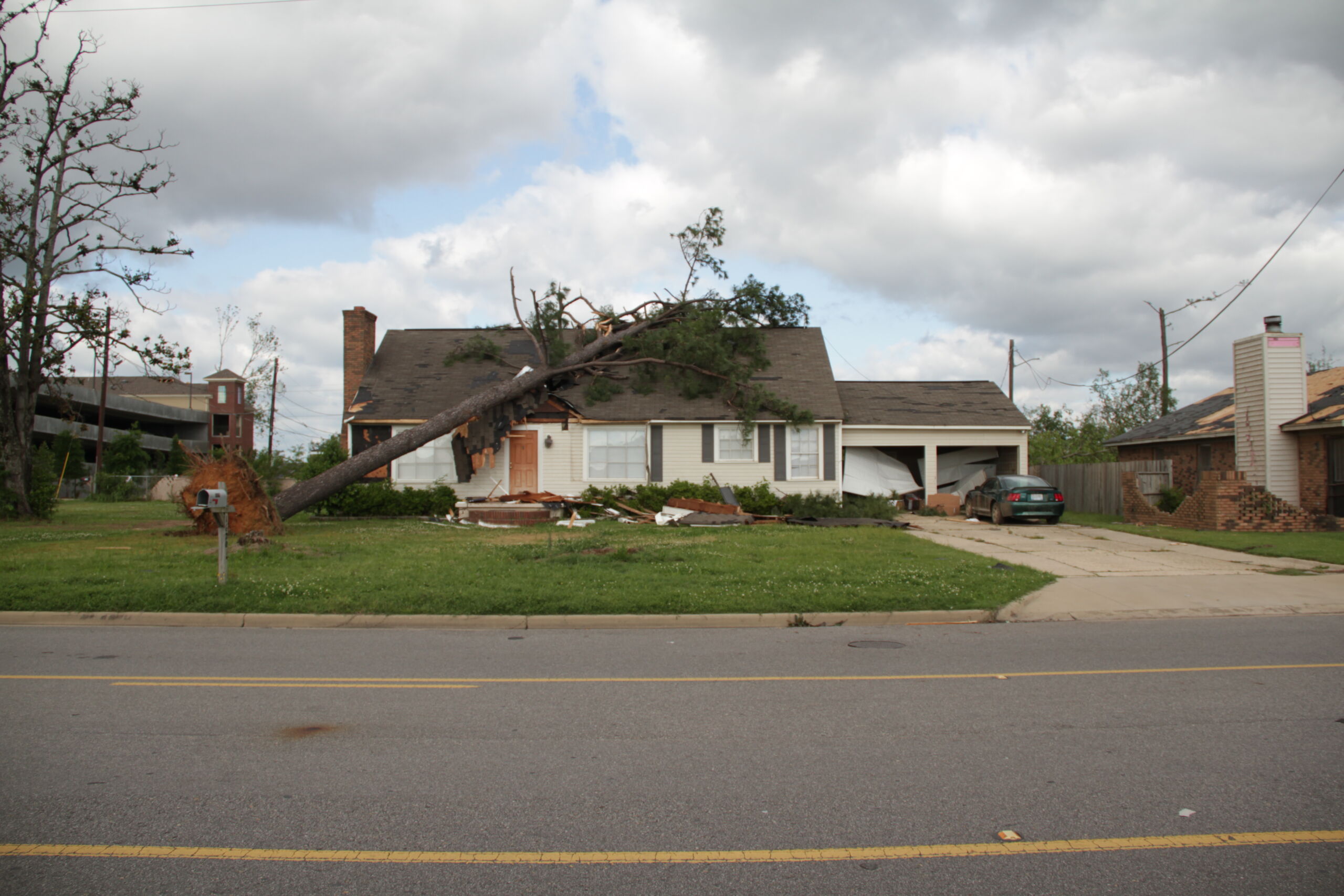 House with a tree that fell on top