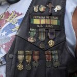 U.S. military medals, including a Purple Heart, along with fake military medals made out of U.S. coins.