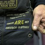 Close-up of biker vest patch that reads, "These are my church clothes."