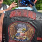 Back side of Ron "Stray Dog" Hall's biker vest featuring giant POW-MIA and "Run for the Wall" patches.