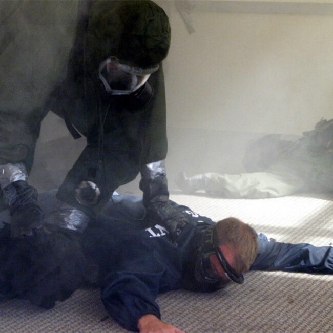 An agent holds down a terror suspect in a government counterterror training exercise.