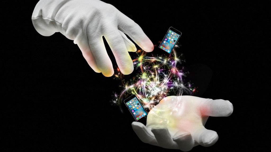 magician's gloved hands conjuring up magic and iphones