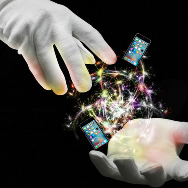 magician's gloved hands conjuring up magic and iphones