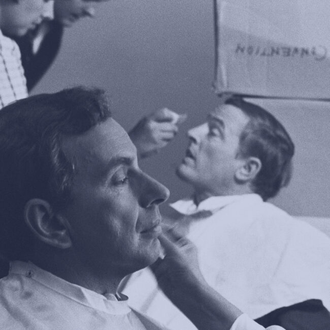 Gore Vidal (front) and William F Buckley (back) are prepped in makeup chairs for their ABC debates