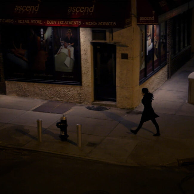 From scene in The Witness, an actress recreates moments before Kitty Genovese was attacked and killed on this same corner in Queens, NY