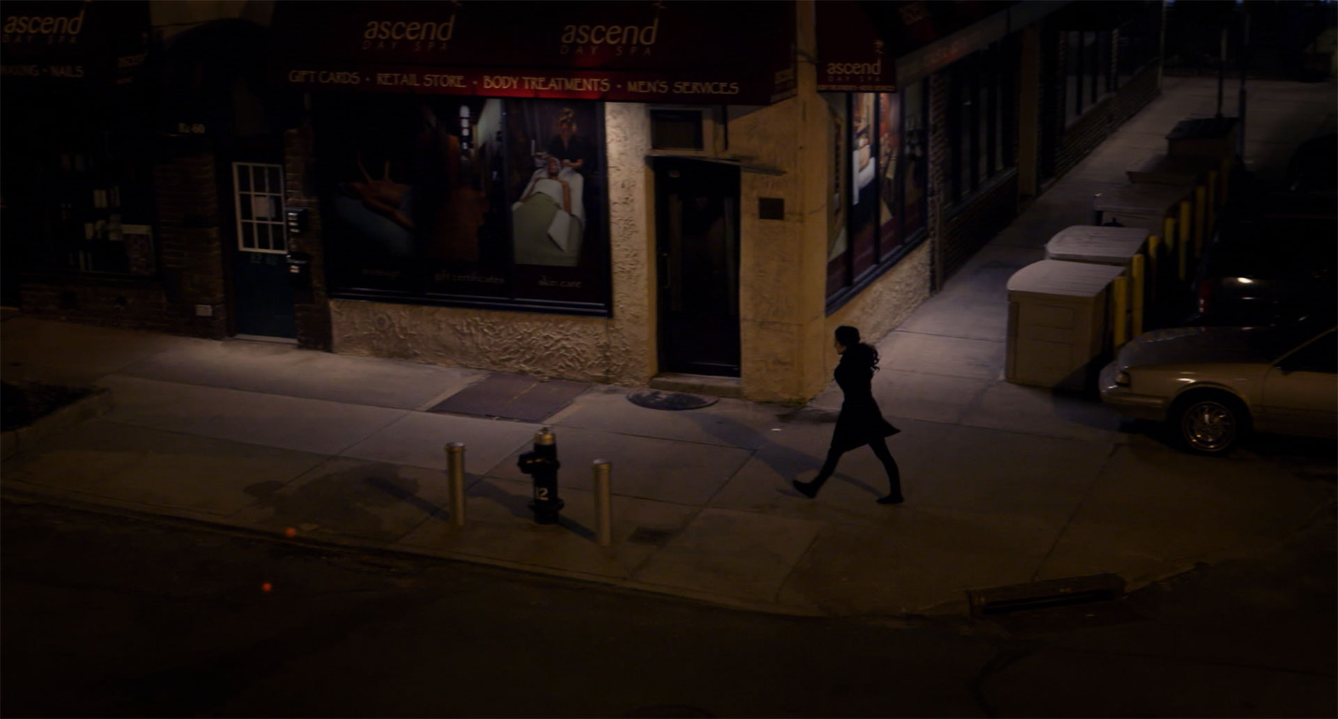 From scene in The Witness, an actress recreates moments before Kitty Genovese was attacked and killed on this same corner in Queens, NY