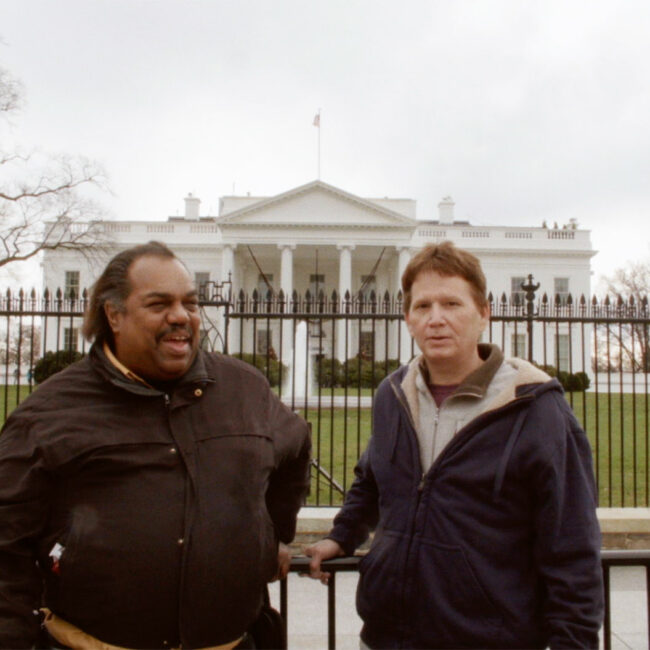 Former Klansman Scott Shepherd (right), with Daryl Davis, in front of the White House, in Accidental Courtesy