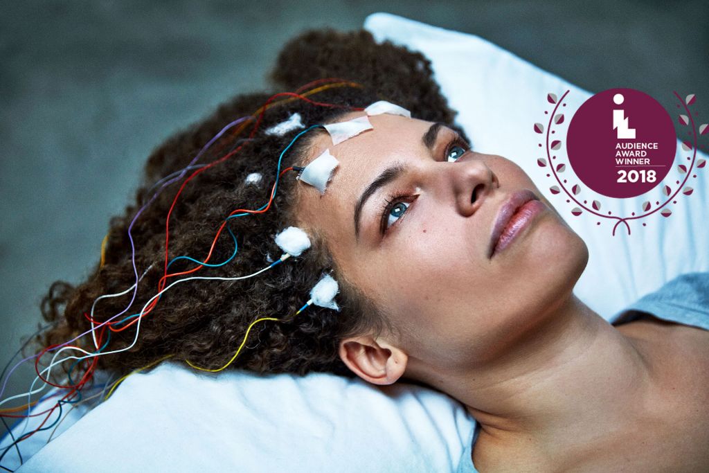 Unrest signature image with Jen Brea getting a test on her brainwaves, including IL audience award graphic now