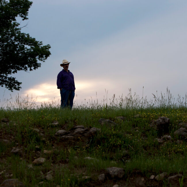Rick Hall stands on a hillside in Muscle Shoals.