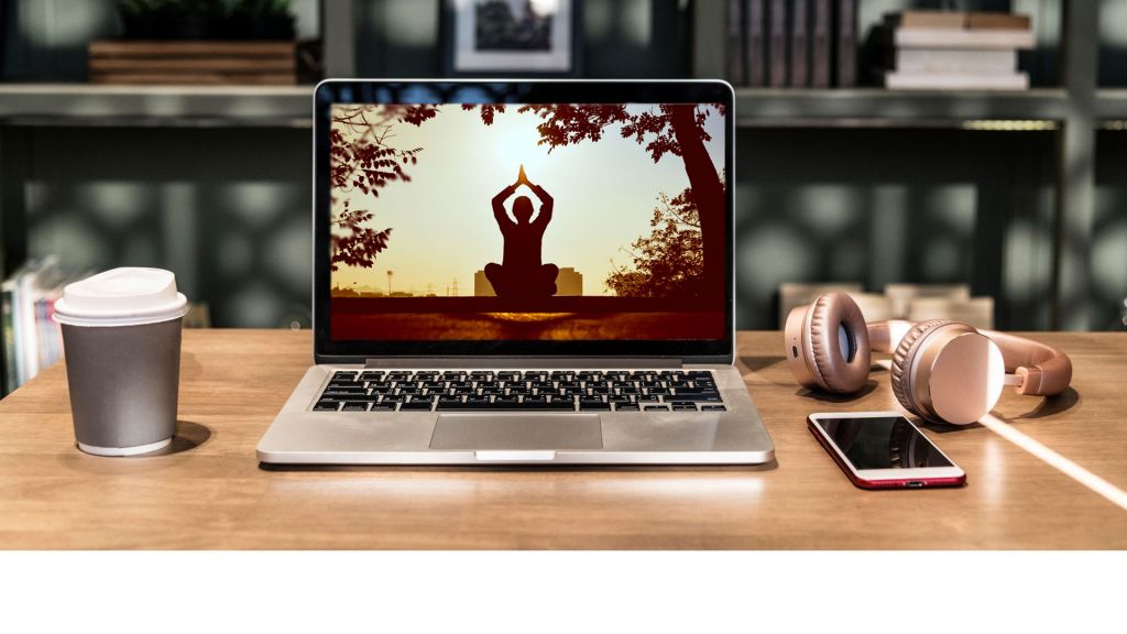 Woman meditating and doing yoga on a laptop screen, images courtesy Pexels.com