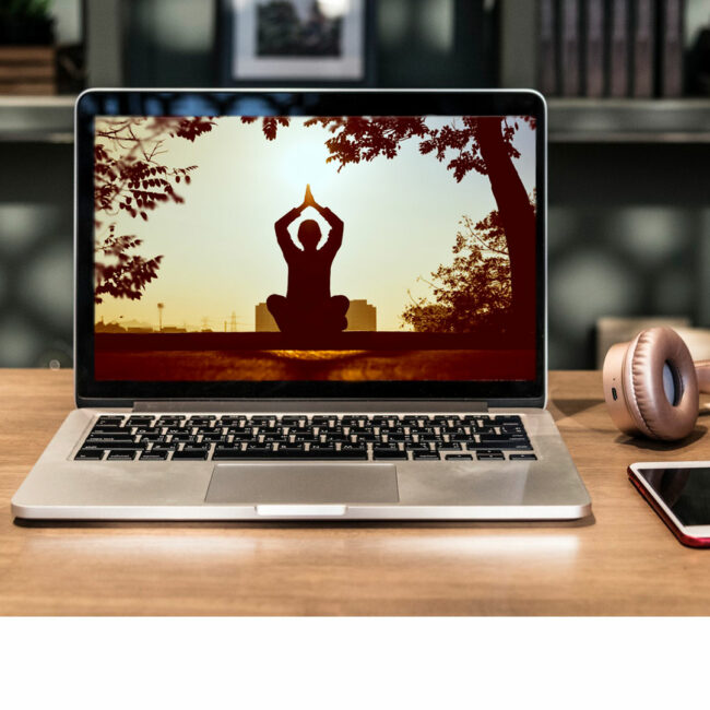 Woman meditating and doing yoga on a laptop screen, images courtesy Pexels.com