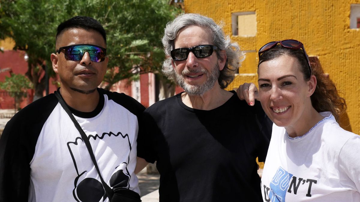 Filmmaker David Sutherland (center) with Marcos and Elizabeth