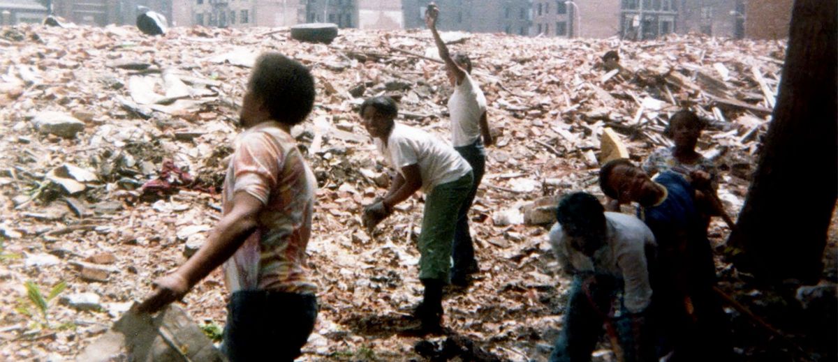 Members of community clear rubble in the Bronx, in Decade of Fire.