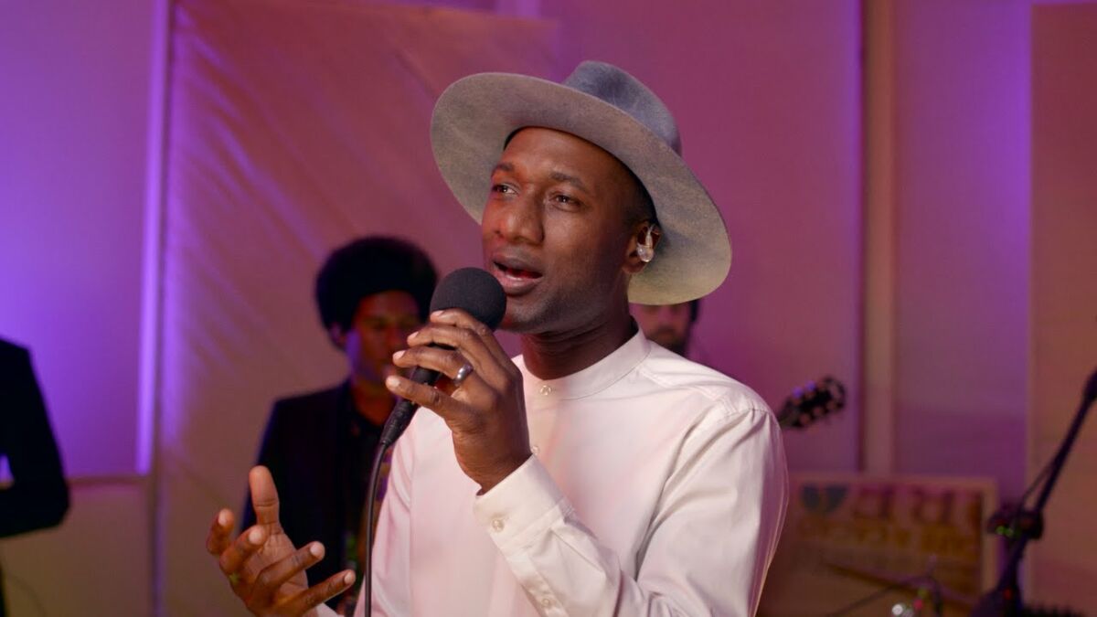 Aloe Blacc performing the song "Other Side" in a special performance for Ferguson Rises and Independent Lens. He's wearing a wide brimmed hat.