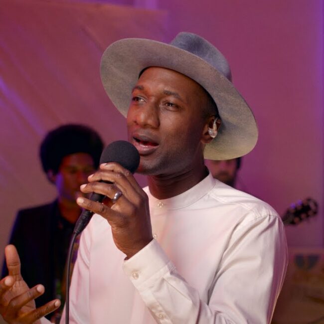 Aloe Blacc performing the song 