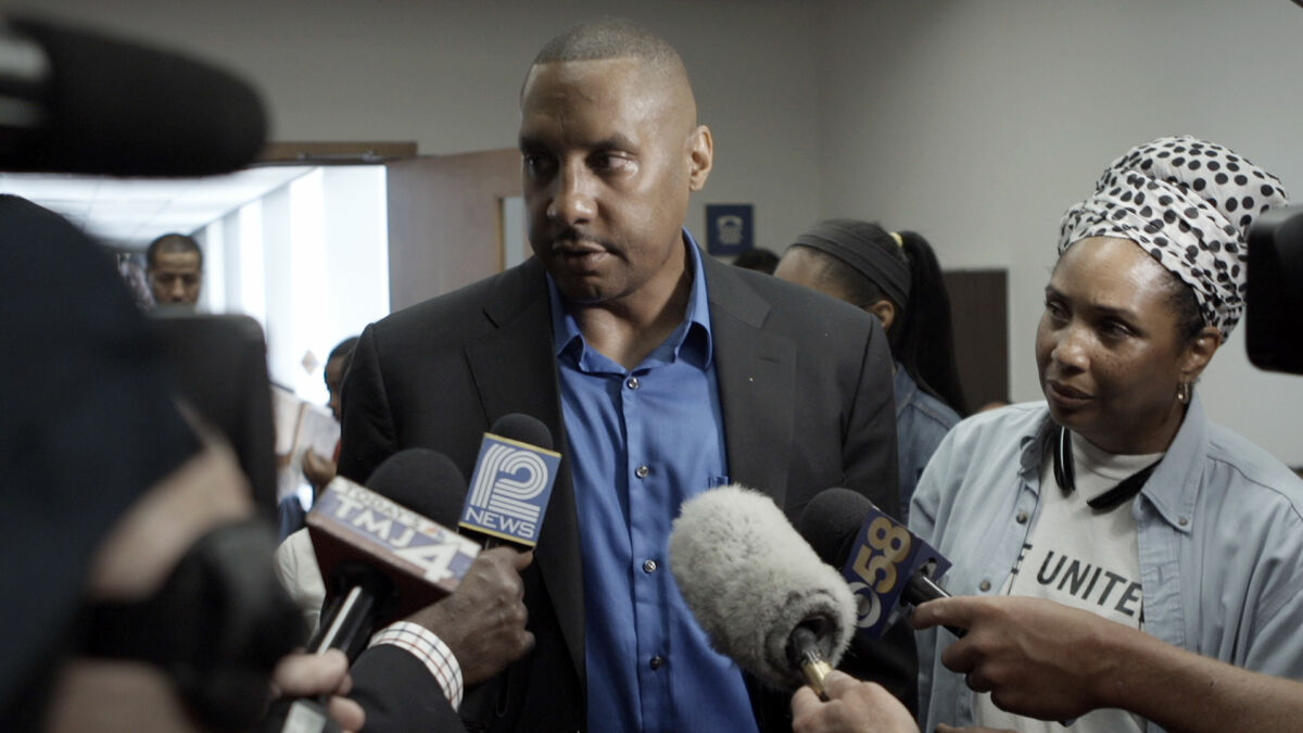 Claude Motley speaks to press after sentencing of the young man who shot him