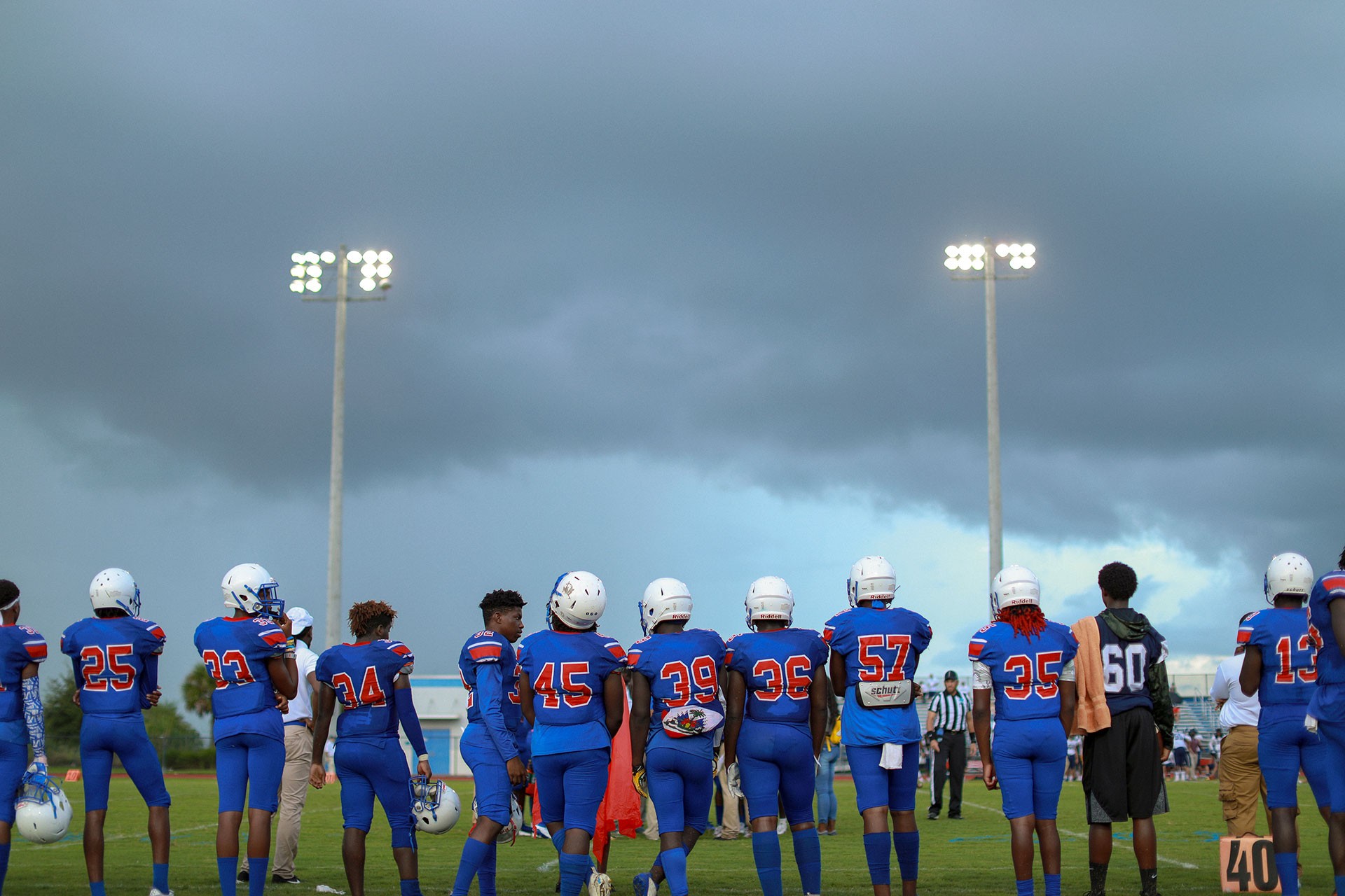 Young men in football uniforms lined up