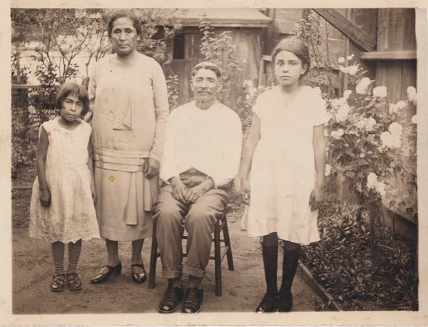 Soledad, right, with her cousin Hope and grandparents Maria and Felipe Chavez, whom she called Mamaria and Papalipe. Courtesy Gloria Velasco Flood-Soledad-family.jpg