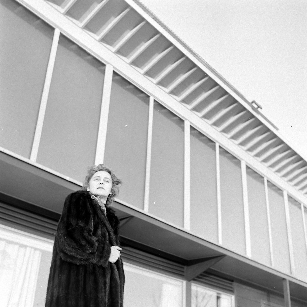 Chemist Maria Telkes poses in front of the very modernist Dover Sun House in Dover, Massachusetts.