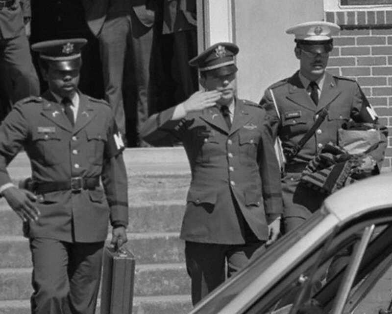 Calley salutes while being escorted from the courtroom. Courtesy: Greg Olsen My Lai Timeline Calley salute 800.jpg