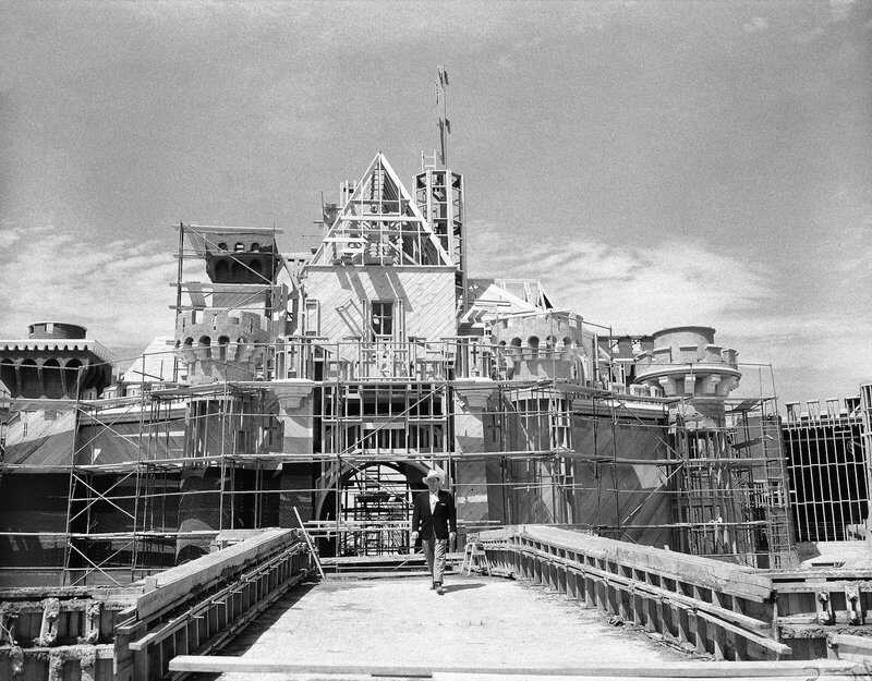 Walt Disney walks on the bridge in front of the partially finished Sleeping Beauty's Castle at Disneyland. Credit: AP Images disney_gallery_empire_Castle.jpg