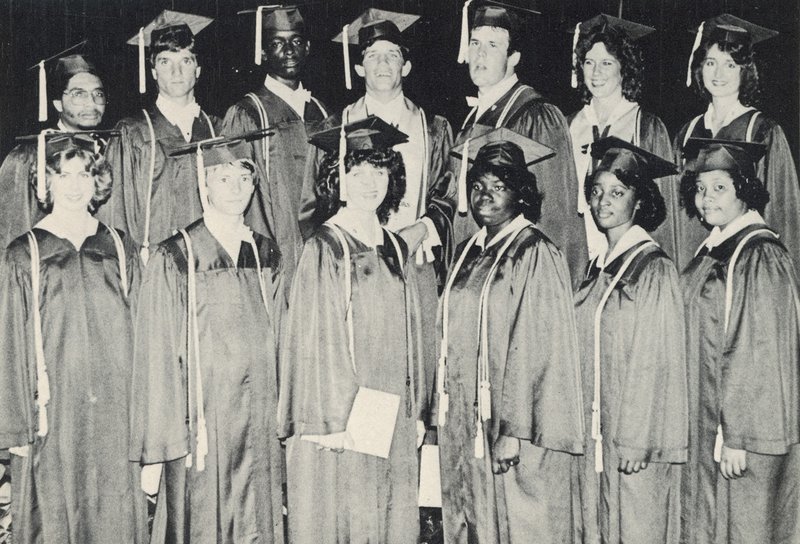 A group portrait of seniors who were receiving academic scholarships. Pam Pepper is far left in the front row and Jessie King is far left in the back row. Van Poindexter is third from the left. Image courtesy of Leland Public School District Harvest-Yearbook-Grads-cap.jpg