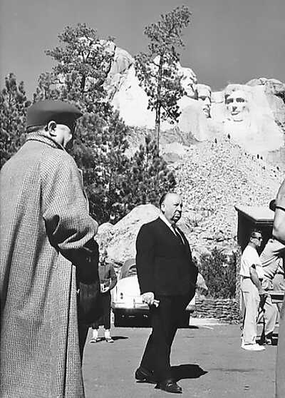 Alfred Hitchcock at Mount Rushmore during the filming of North By Northwest.12 October 1958. PD. Rushmore-North-by-Northwest.jpg