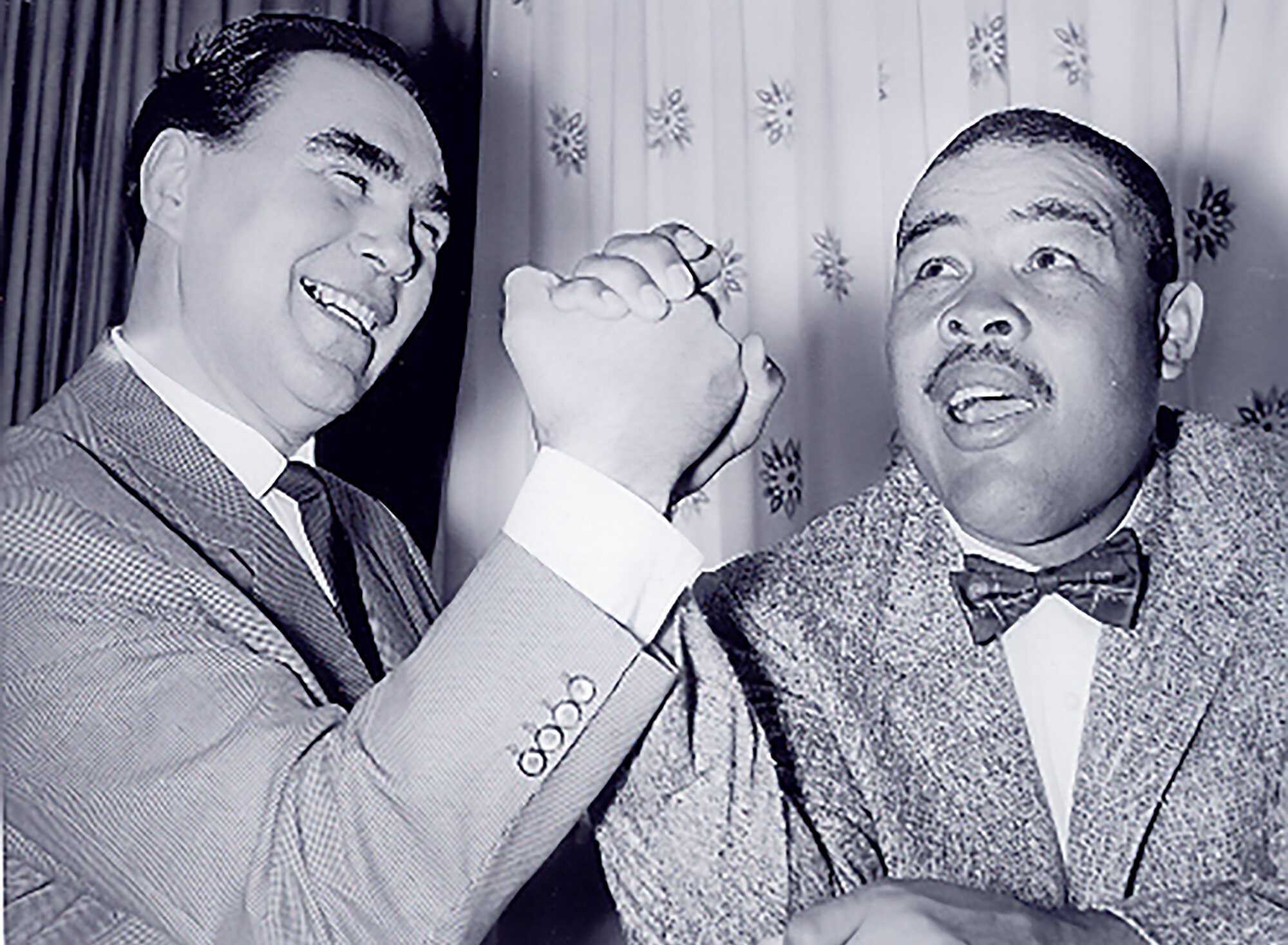 Schmeling comes to America and renews an acquaintance with Louis. 1954. AP Worldwide Photos Fight-timleine_1954.jpg