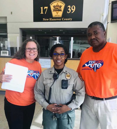 You Can Vote volunteers with a deputy at the New Hanover County Detention Facility in 2019. Photo by Kate Fellman Vote-GroundTruth-N-Carolina-New-Hanover.jpg