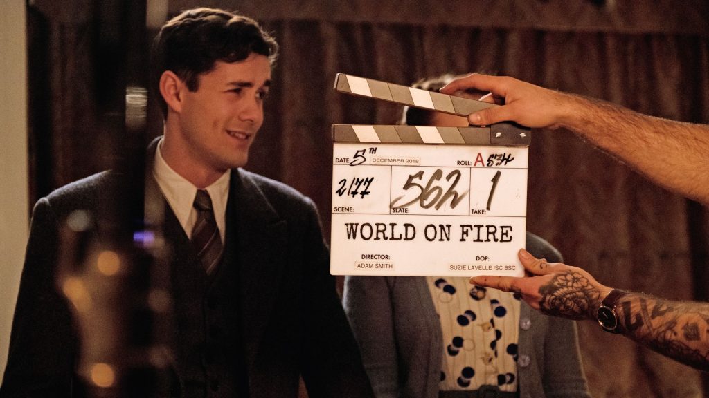 Jonah Hauer-King and Julia Brown prepare for a scene in World on Fire, Season 1