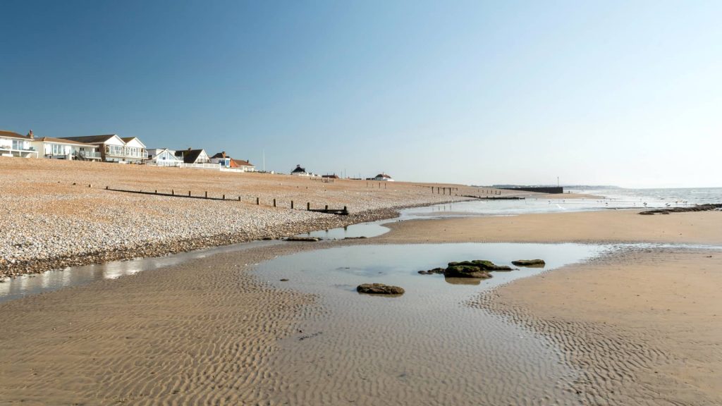 Normans Bay, in East Sussex, has a shingle (rock and pebble) beach, with wide, shallow sand flats exposed at low tide.