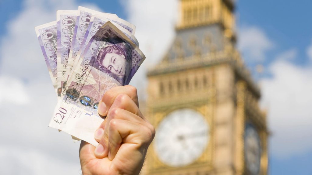 Handful of £20 notes being held up out the House of Commons