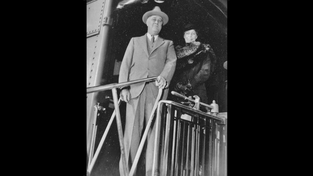 Franklin and Eleanor Roosevelt disembark a train, November 1935