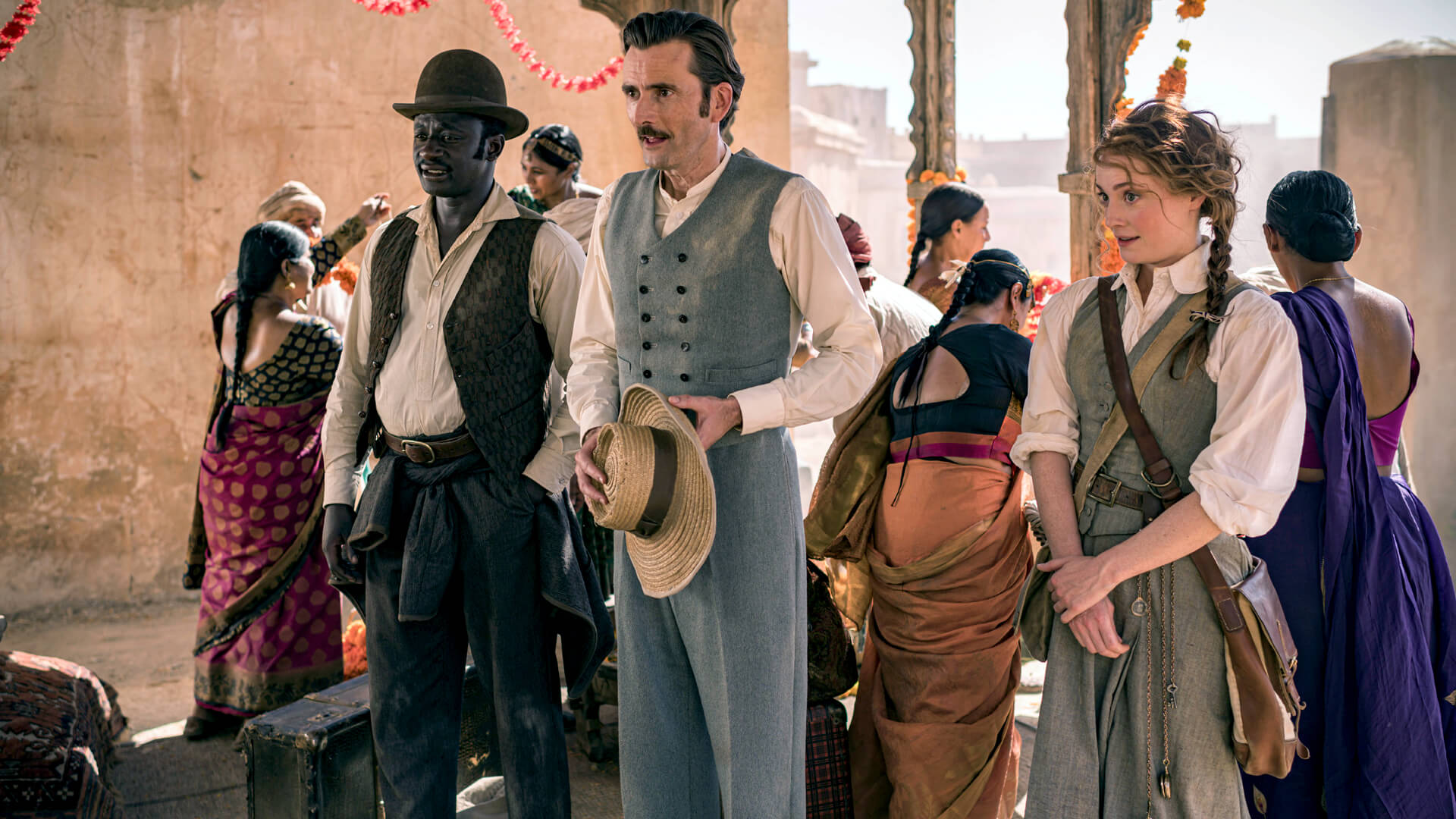 Actors Ibrahim Koma, David Tennant, Leonie Benesch (left to right) in a scene from Around the World in 80 Days on PBS MASTERPIECE.