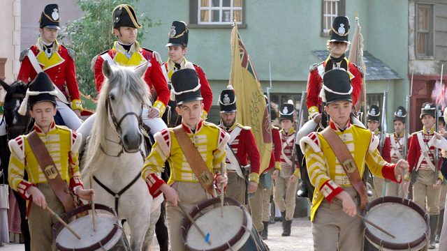 A scene of British militia on parade in Sanditon Season 2 on MASTERPIeCE on PBS.