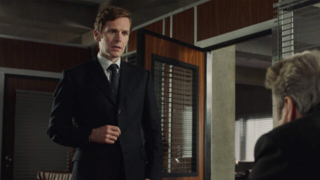 Shaun Evans as Endeavour Morse standing in DCI Fred Thursday's (Roger Allam) office