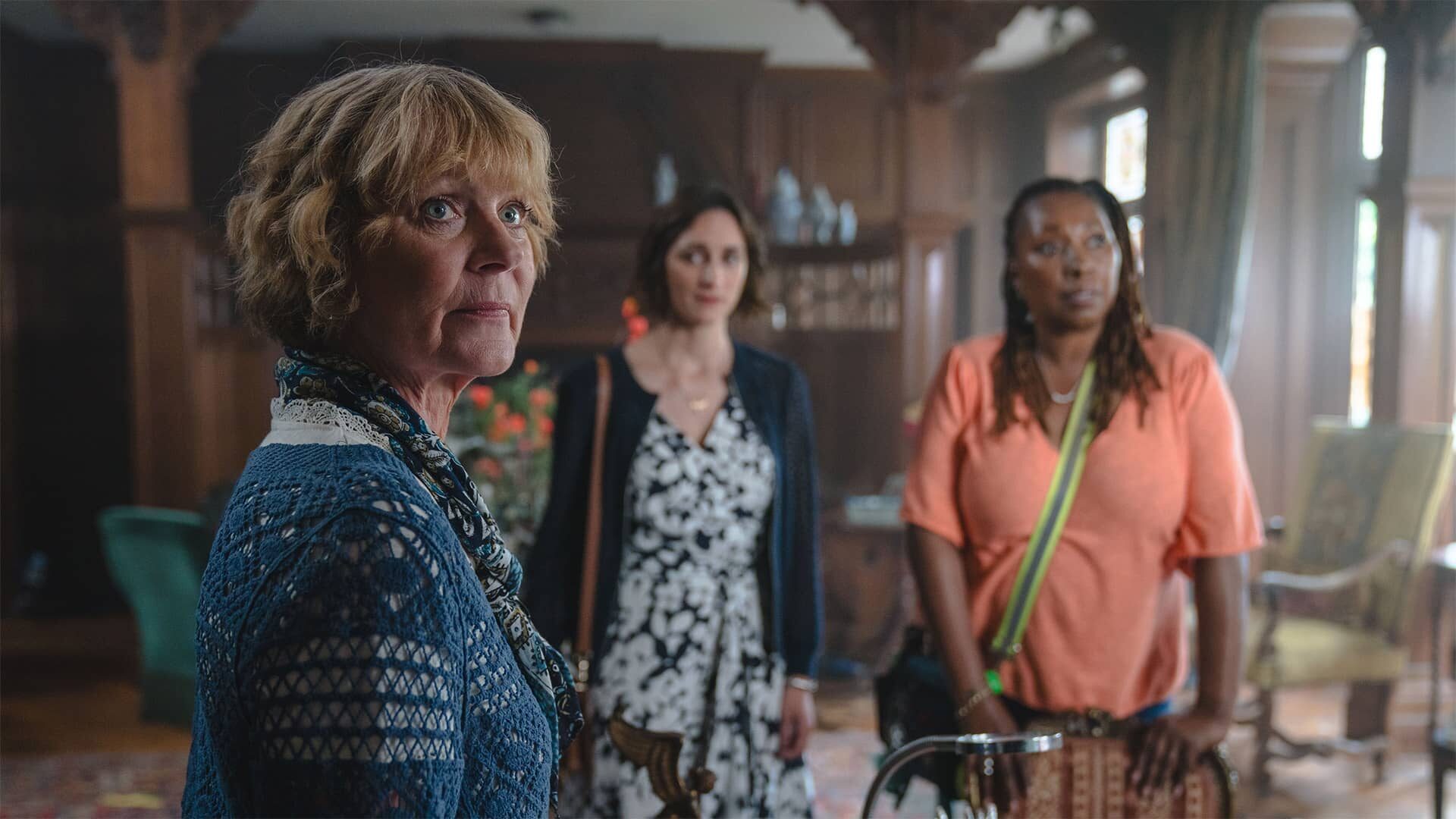 Samantha Bond as Judith Potts, Cara Horgan as Becks Starling and Jo Martin as Suzie Harris standing together in The Marlow Murder Club