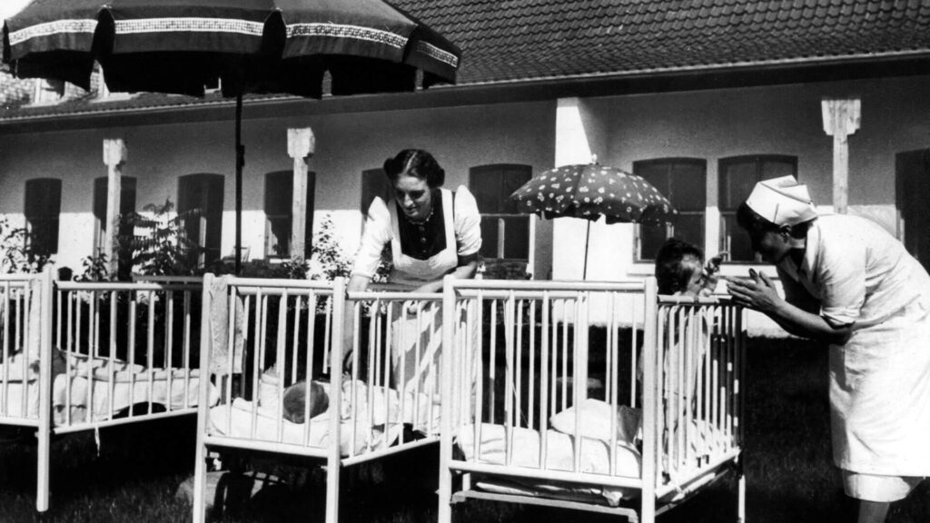 Photo of nurses and infants at a German Lebensborn maternity home, 1940.