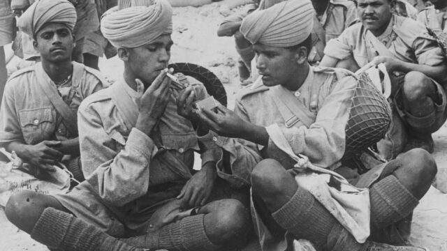 Photo of Indian Army troops during a rest break in the Wester Desert, WW2.