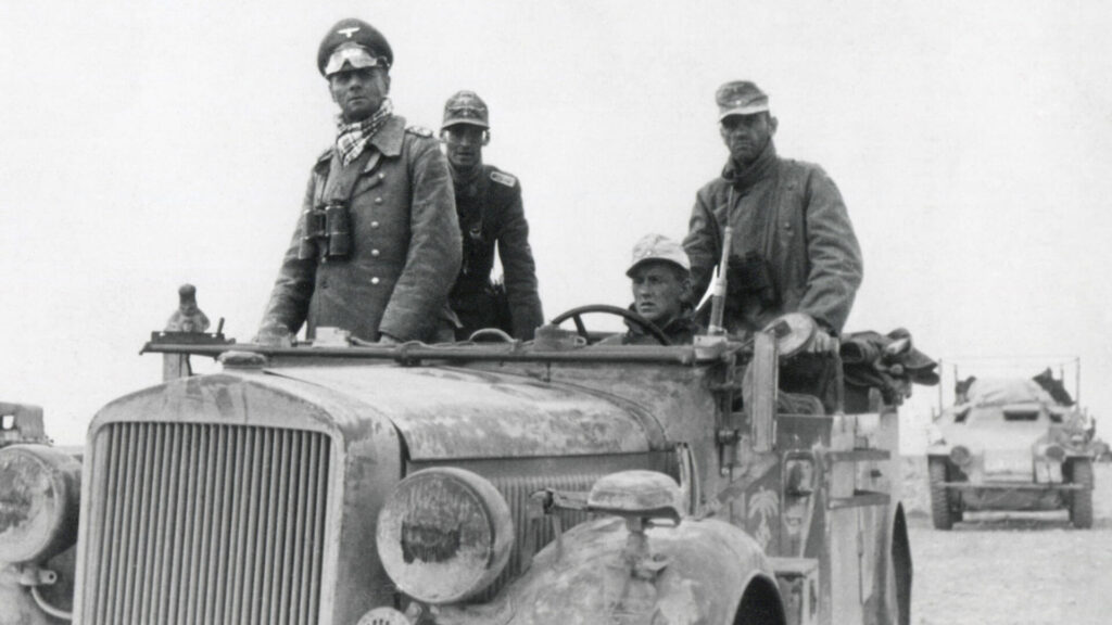 Black and white photo of Major General Erwin Rommel with the 15th Panzer Division in WW2 Libya, 1941.