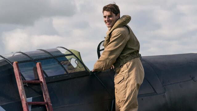 Gregg Sulkin as pilot David getting into his plane in World on Fire Season 2