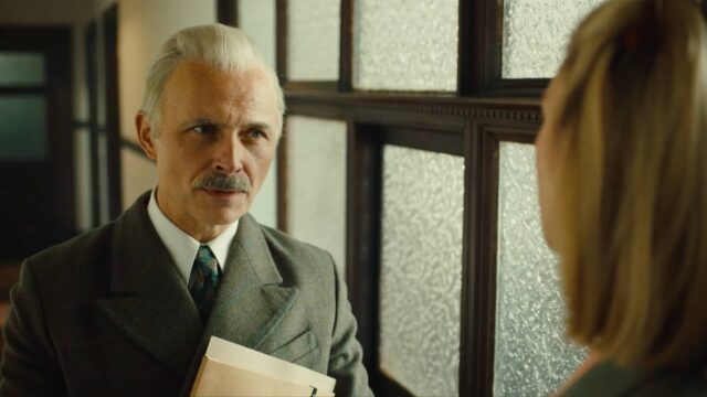 Mark Bonnar as Sir James speaking with Kasia (Zofia Wichlacz) in World on Fire Season 2