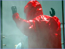 Man being sprayed with decontaminant