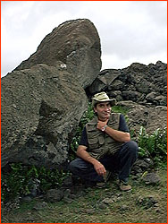 Photo of Claudio
Christino in front of fallen moai