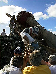 Photo of team raising the Moai