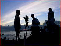 The film crew, silhouetted against the sunset